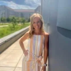 woman next to a wall